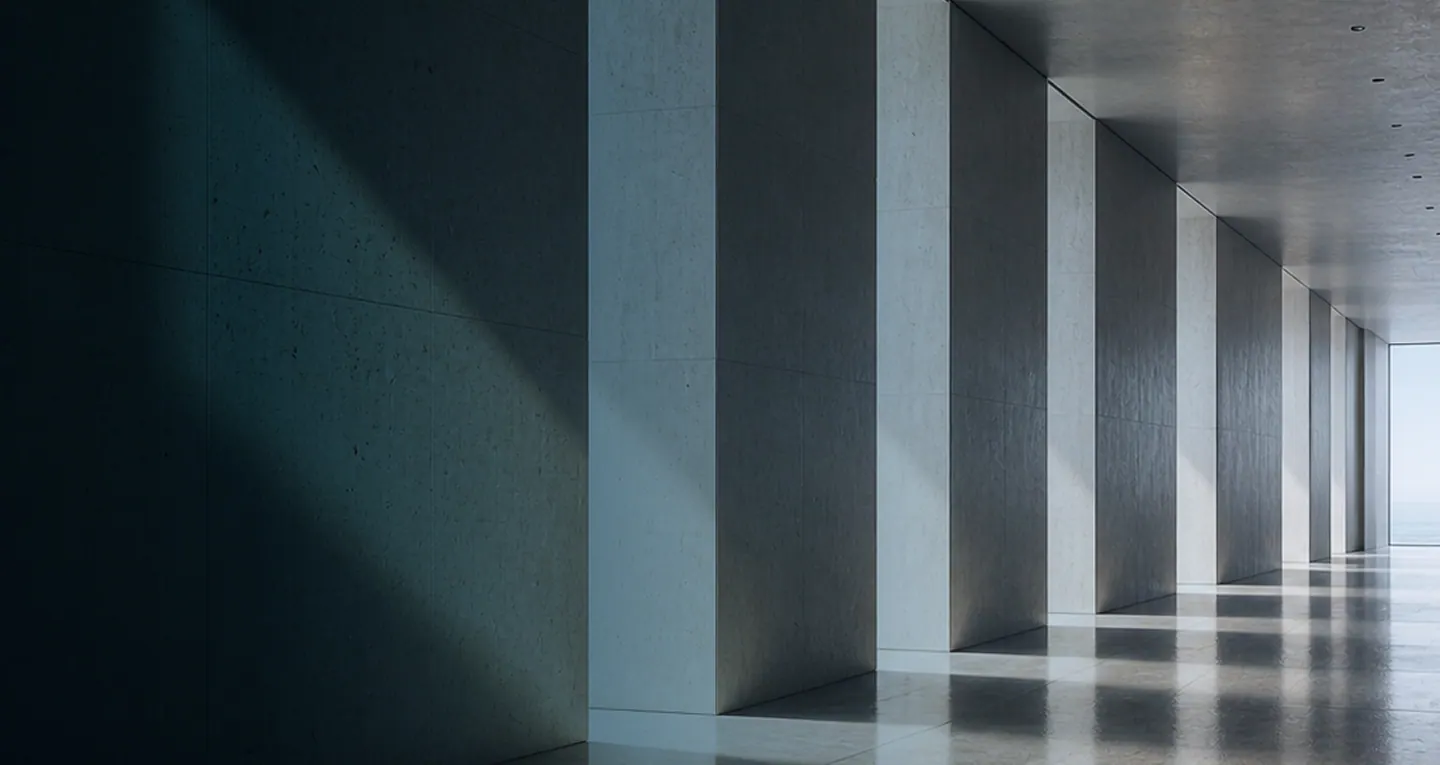 Concrete corridor with columns and natural light